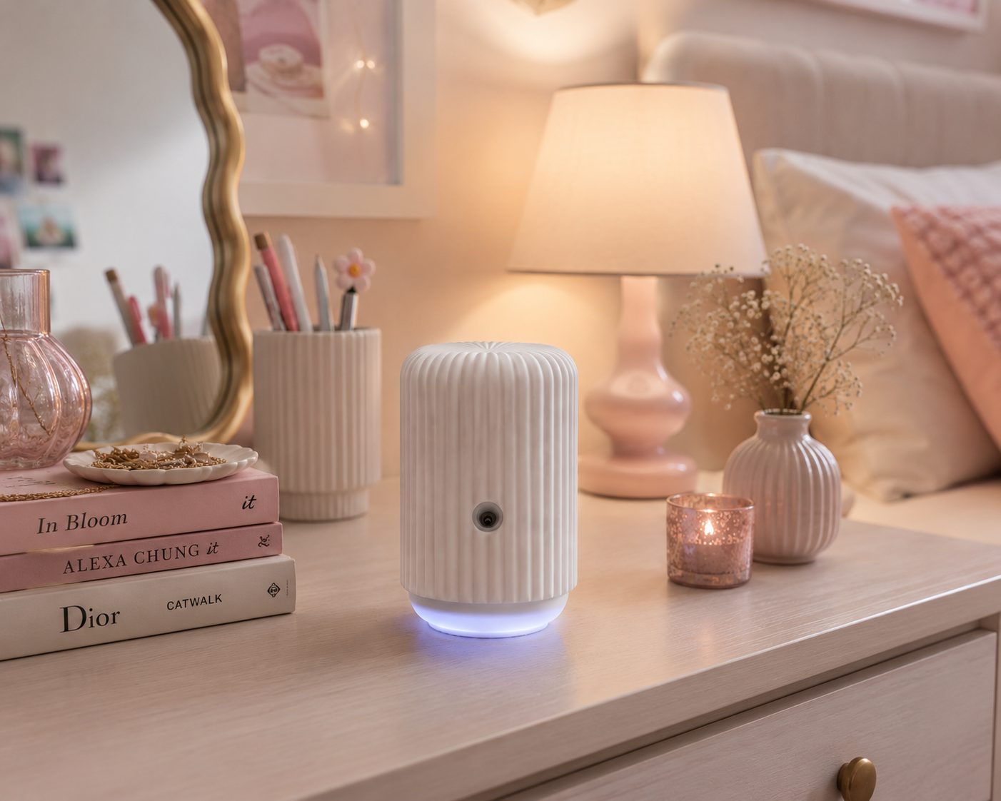 Scentsy Solo styled as a gift on a feminine vanity with books and soft lighting